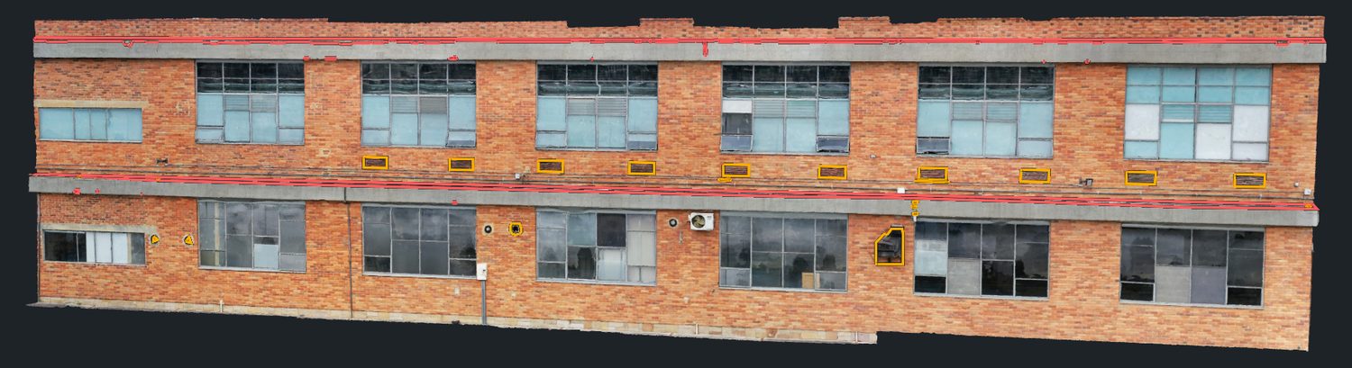 Modelo 3D de una fachada con los desprendimientos marcados en rojo y la corrosión en amarillo